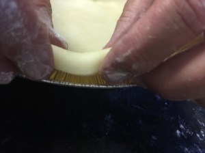 Fold under the crust. Pinch it all the way around. Looks so fancy when it's done.